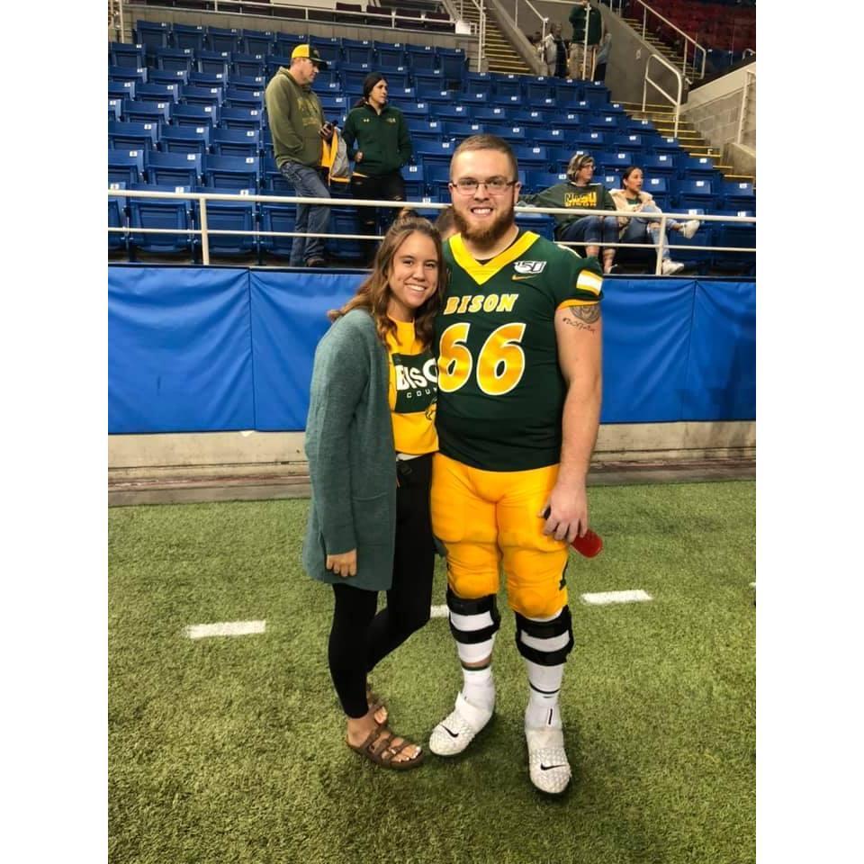 My first time watching him play football!  A month or so after we started dating.