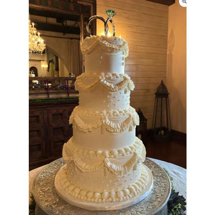 Cake. 4 tiers, 4 flavors. Eddie is boujee. No this is not the cake.