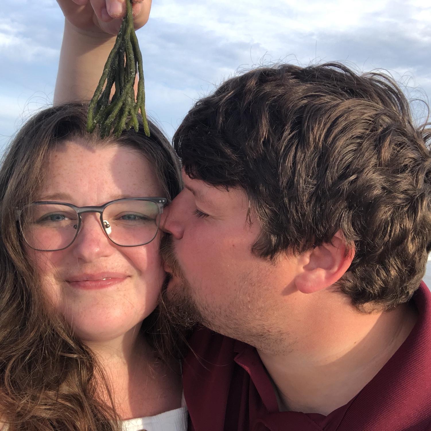 Zach being cute with seaweed instead of a mistletoe