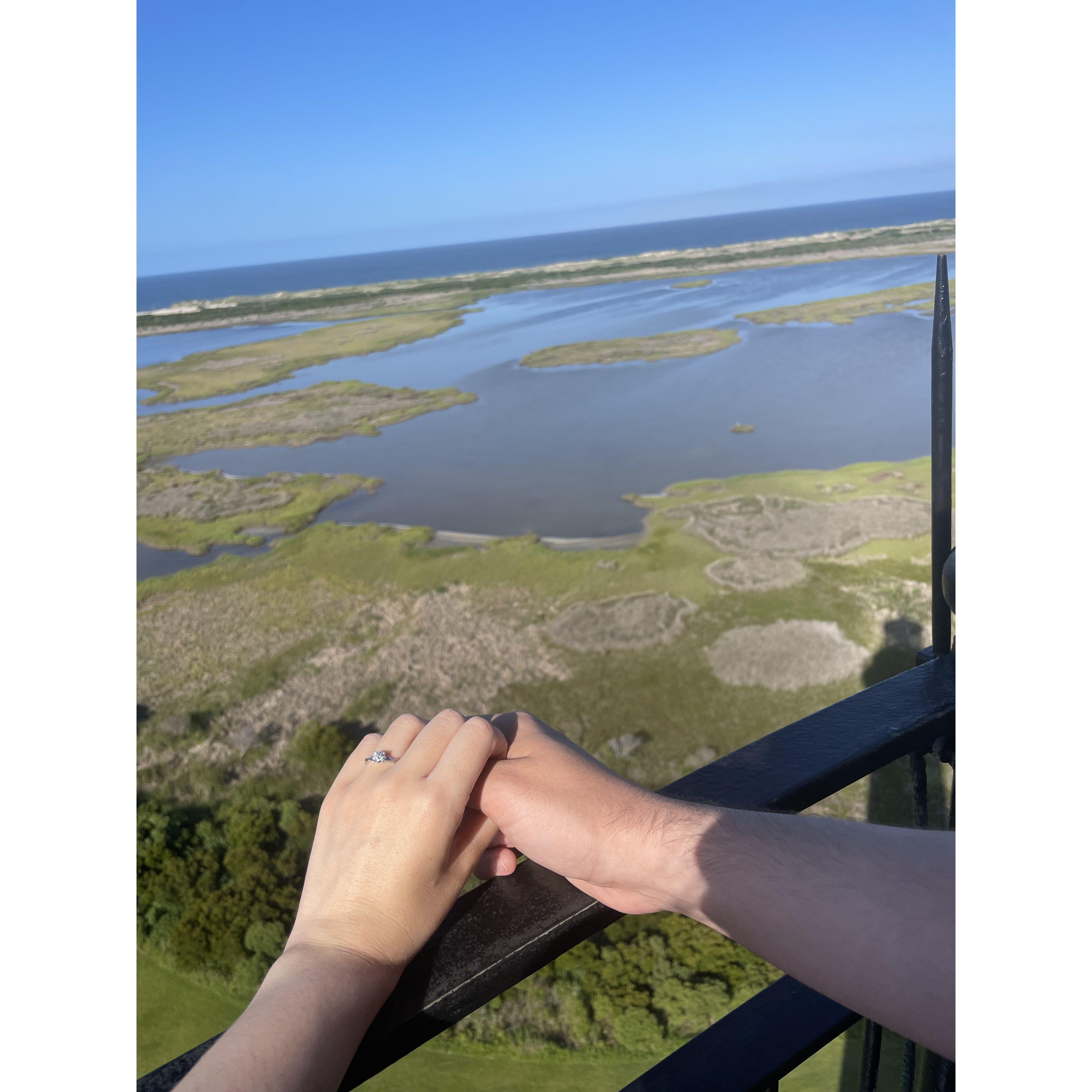 Newly engaged on top of Bodie Island lighthouse!