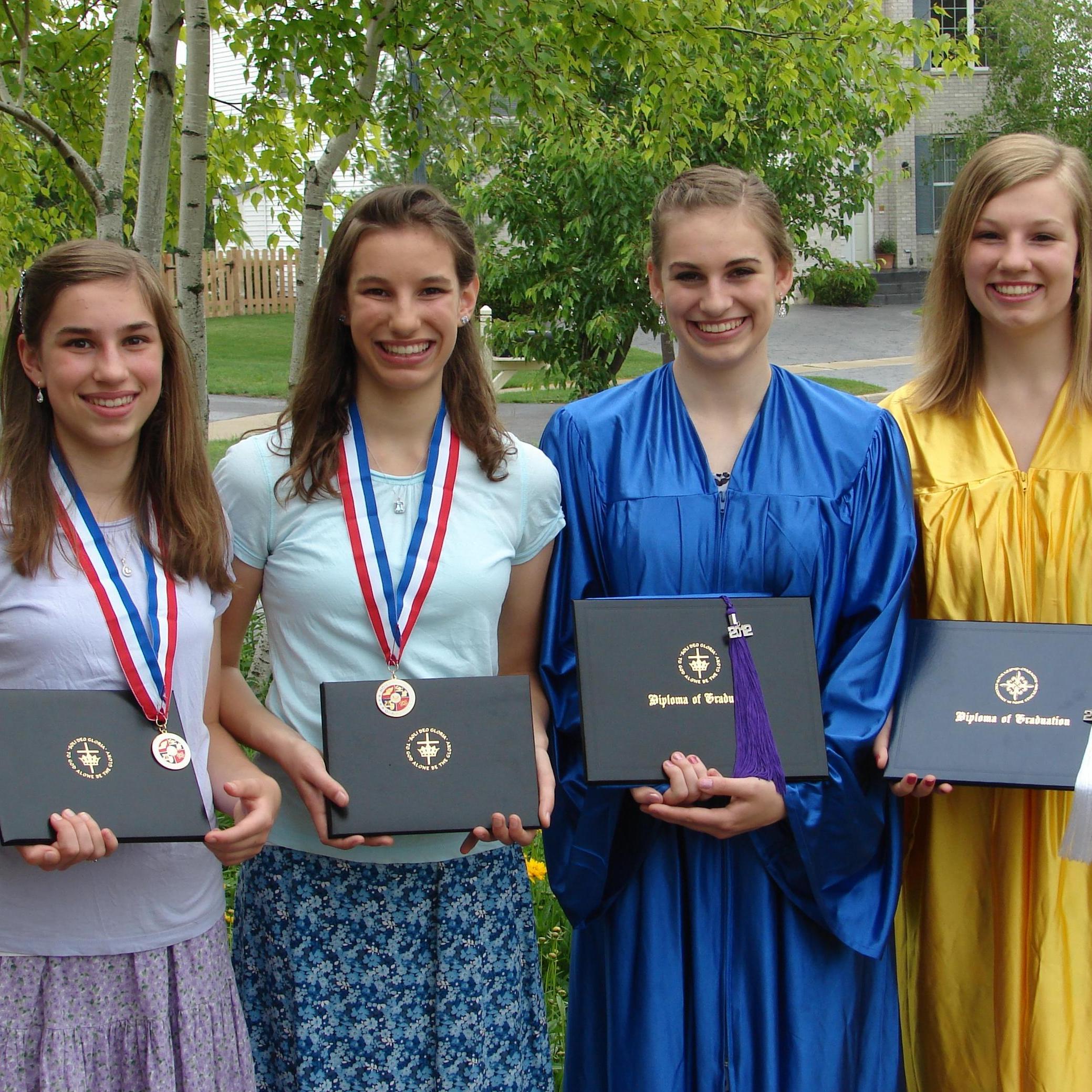 Mia, Sarah middle school graduation, Elizabeth, Catie high school graduation. (2012, Round Lake, IL)