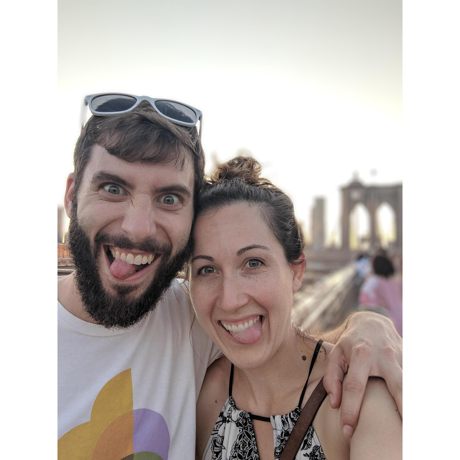 This photo is from our travels to NY and is taken on the Brooklyn Bridge. We are looking forward to many more adventures together as a married couple!