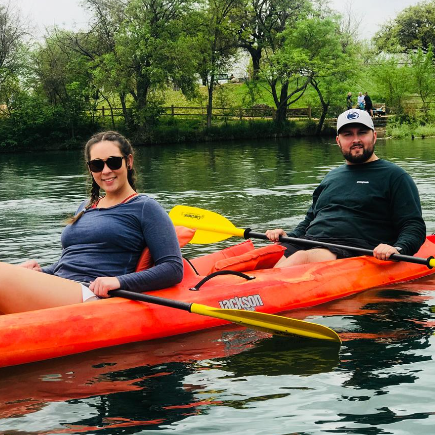 Kierstin pretending to row the kayak.