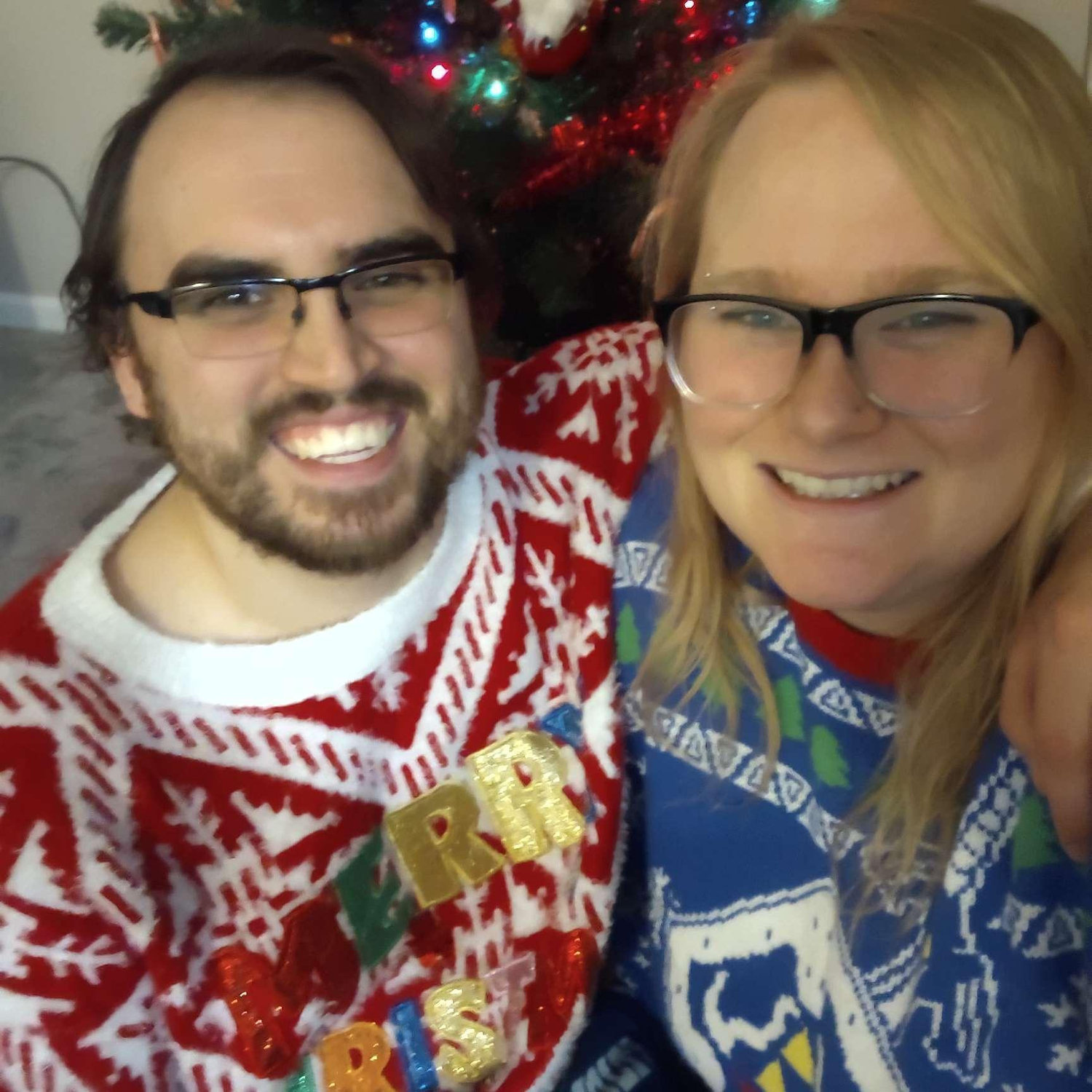 First Christmas together! Alex wasn't satisfied with the first few pictures, so kept cracking jokes until Arliss gave a smile he felt was perfect.