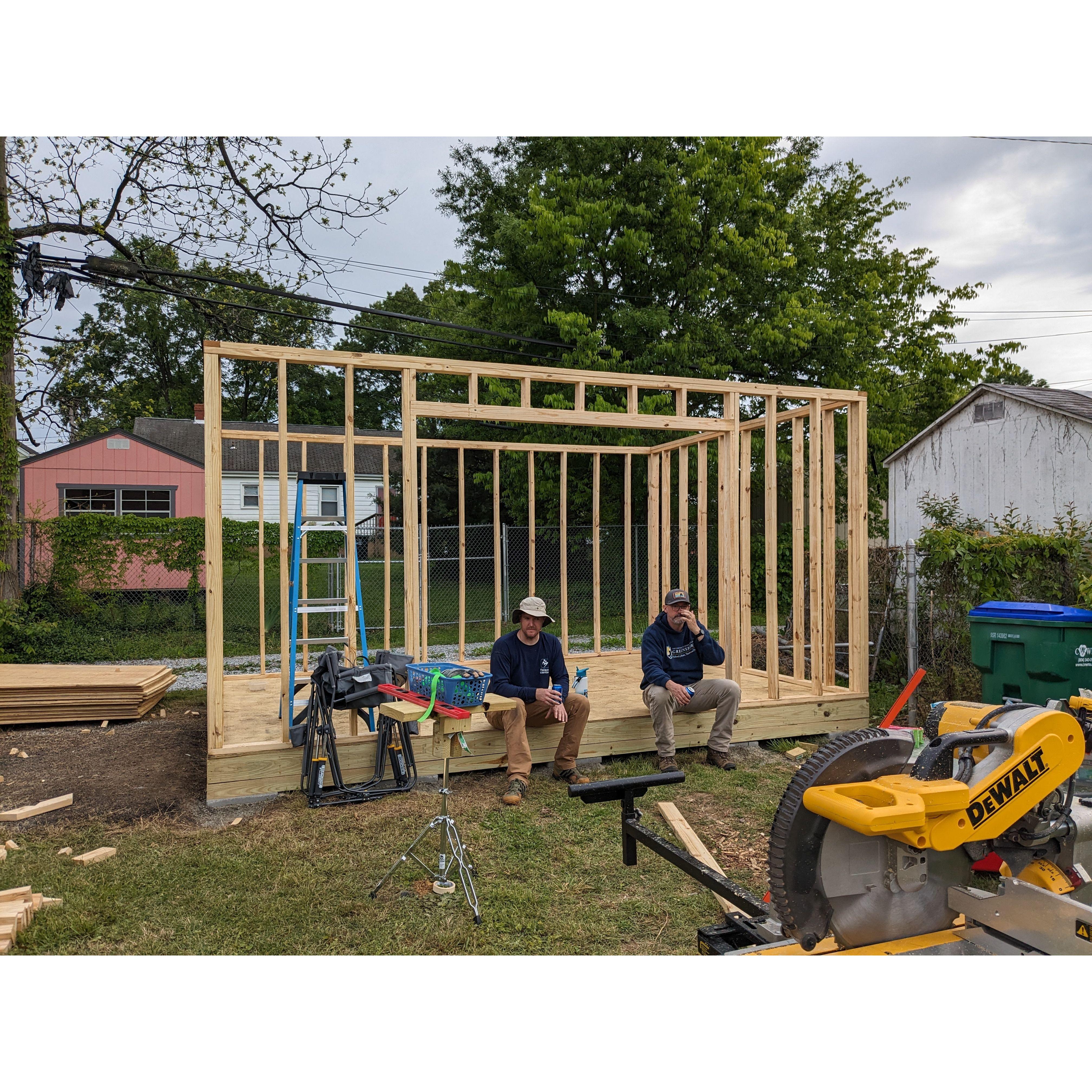 Two hard-working guys, Aaron and Chris, taking a break in the framework of the soon-to-be shed.