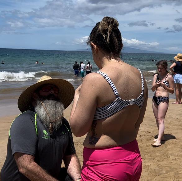 April 10, 2023. The proposal was a surprise to me. His sisters were camera ready as I came out of the water from snorkeling (a new experience for me).