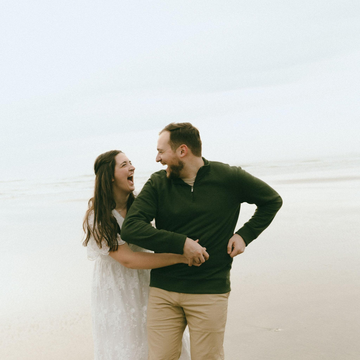 The photographer told Kara to tickle Travis just before this photo was taken