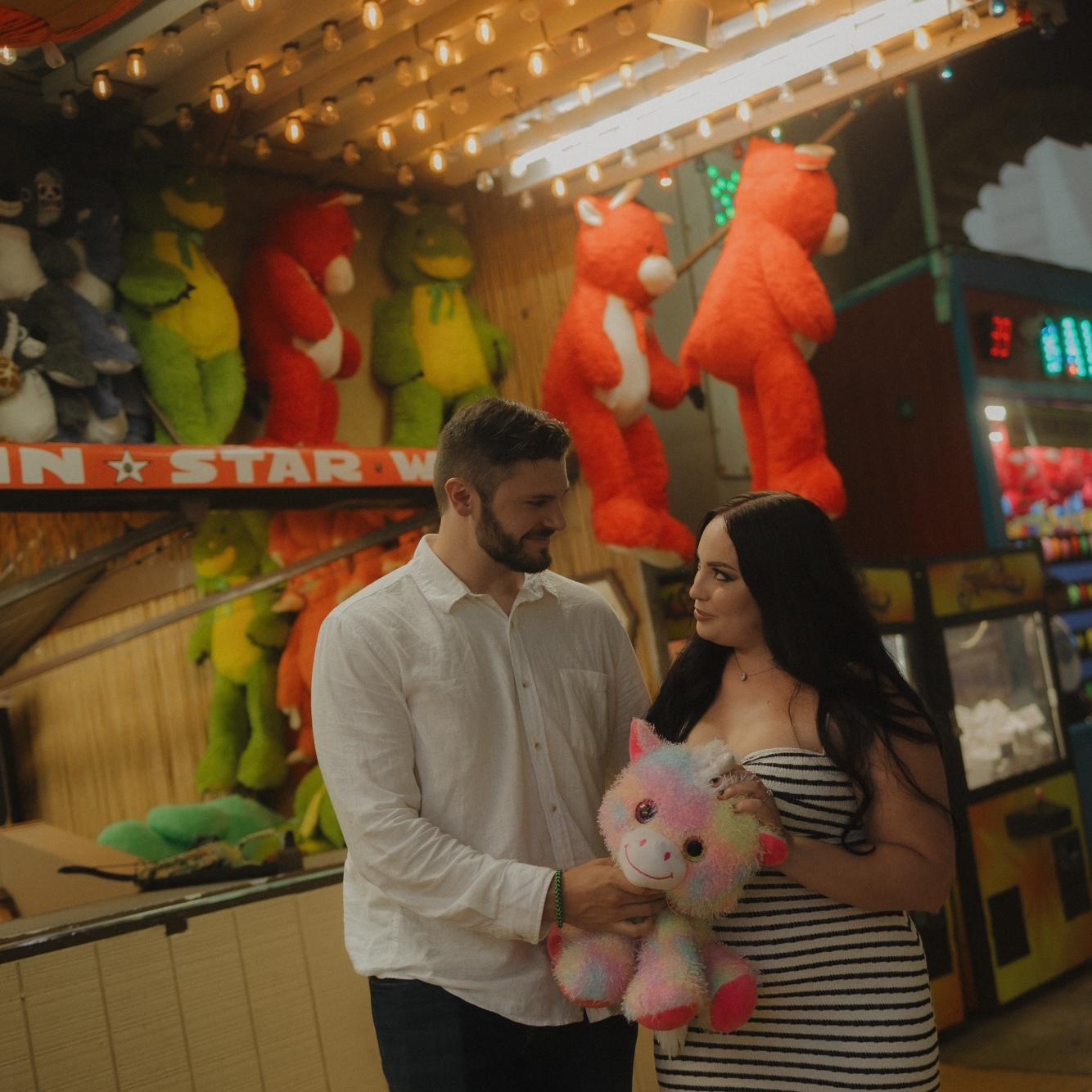 Konnor won Izabella a stuffed animal with his carnival game skills 😎