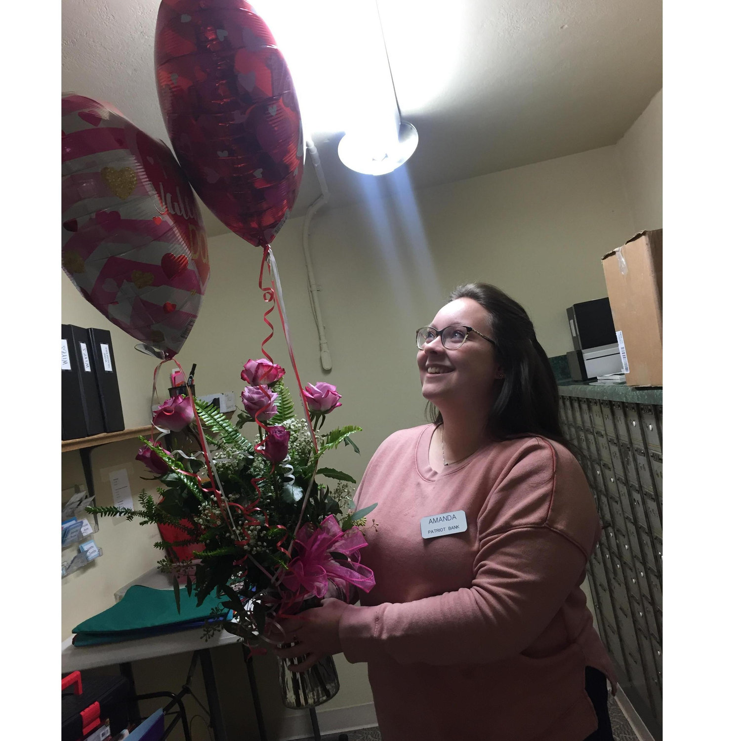 Austin surprised Anna with a beautiful bouquet of roses at work on Valentine's Day 2020