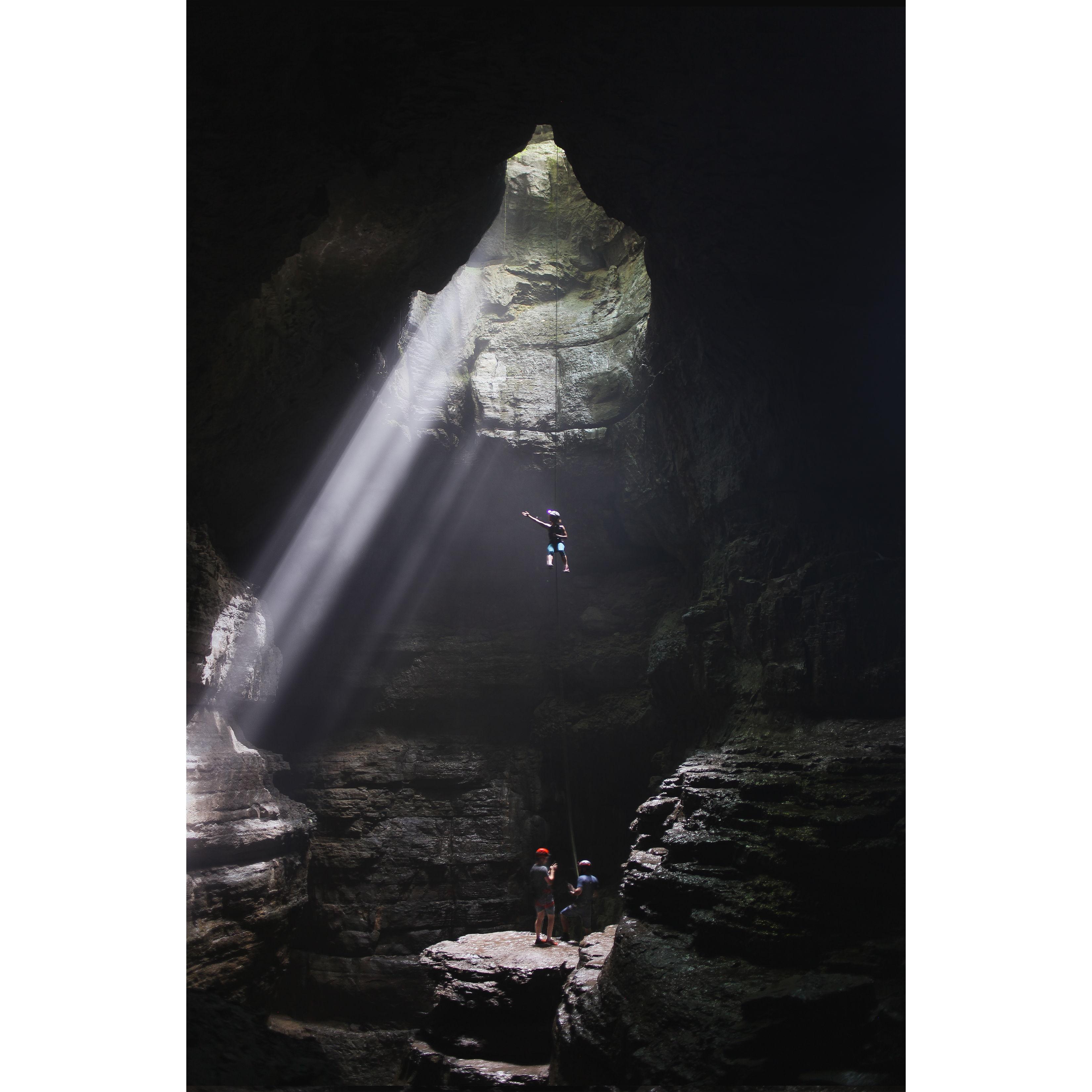 Delaine rappelling into the cave where we met