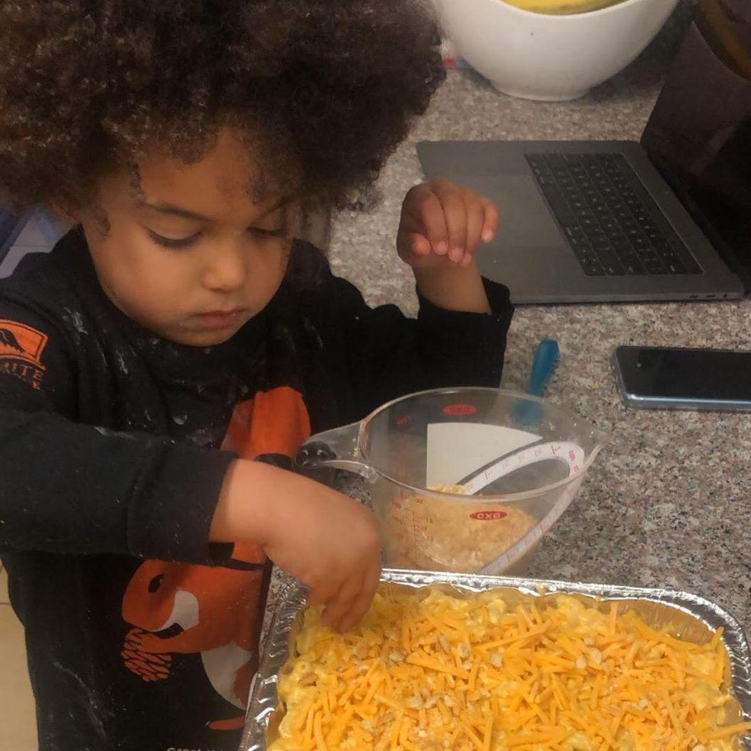 SJ helping mommy make Mac n cheese for our first Easter all together!