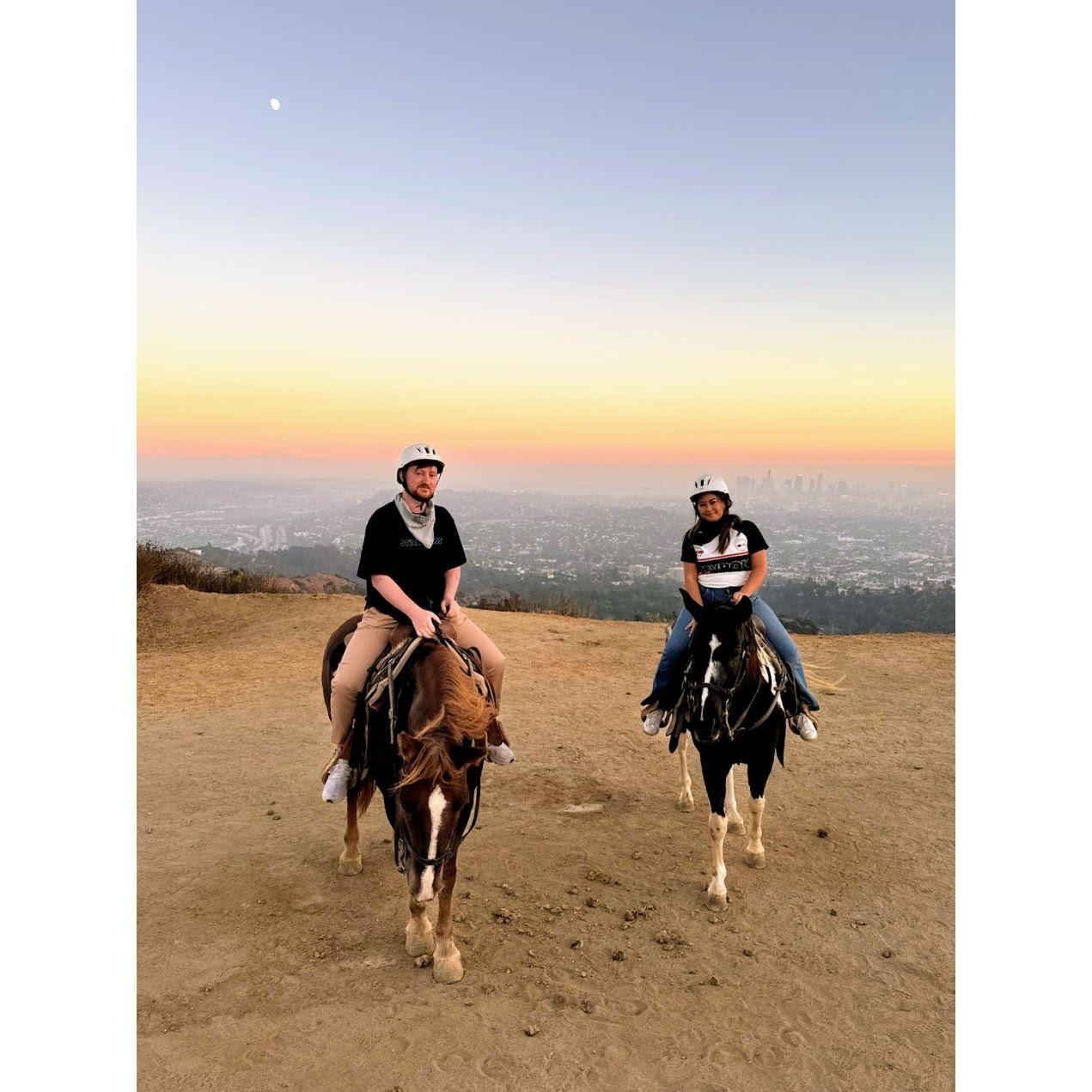 Horseback riding through the Hollywood Hills in Los Angeles at sunset