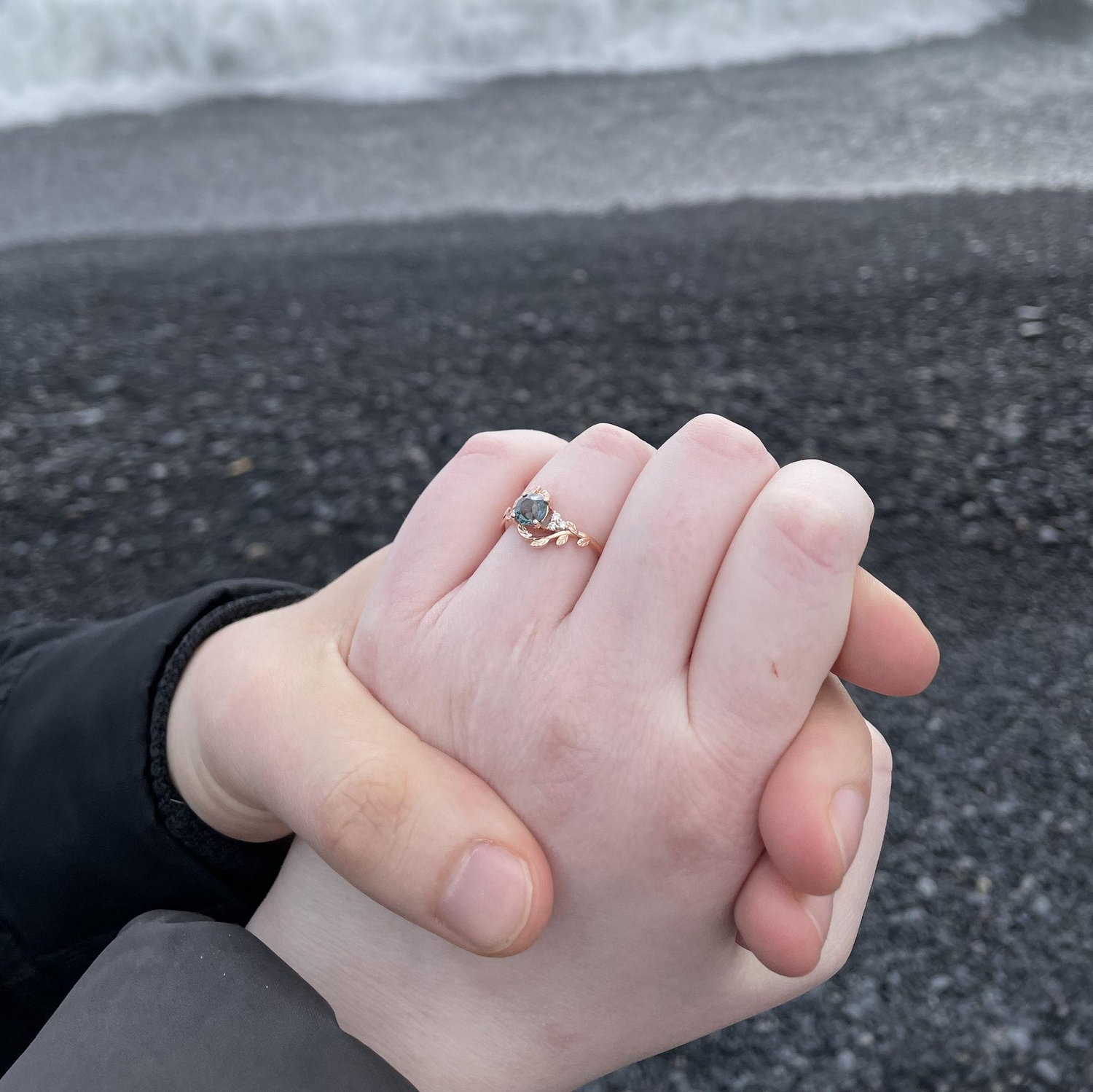 Engagement ring on the black sand beach.