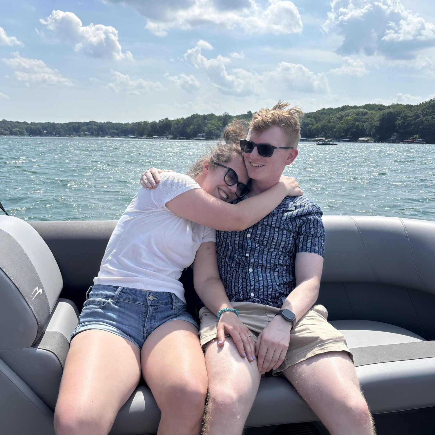 David proposed on Amanda's family's pontoon on a lake she spent her childhood, July 2025