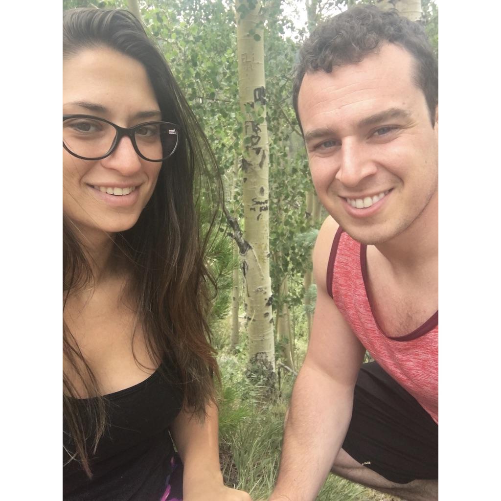 Carved our names into the tree behind us on the side of the road in Colorado!