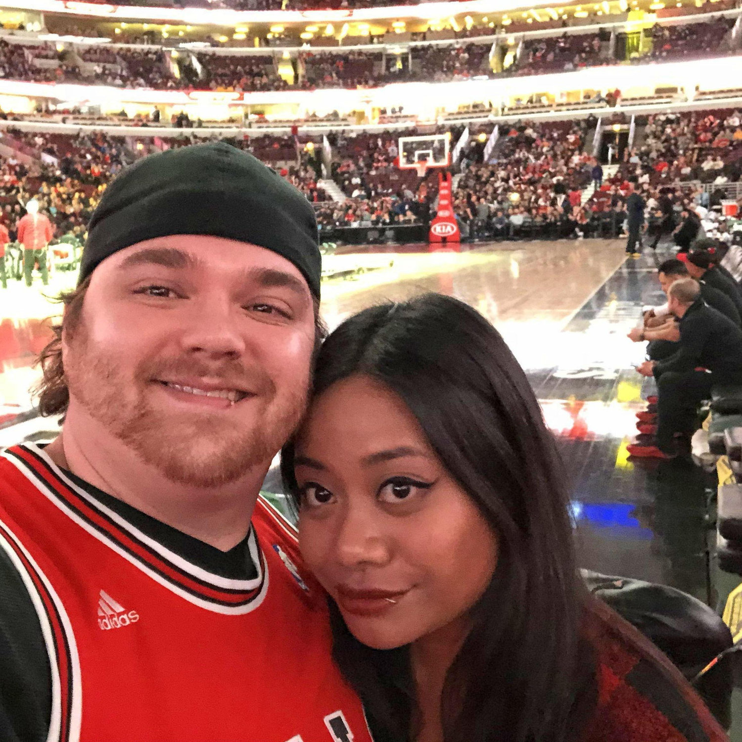 One of our first dates and sporting events together, sitting courtside to watch the Chicago Bulls!