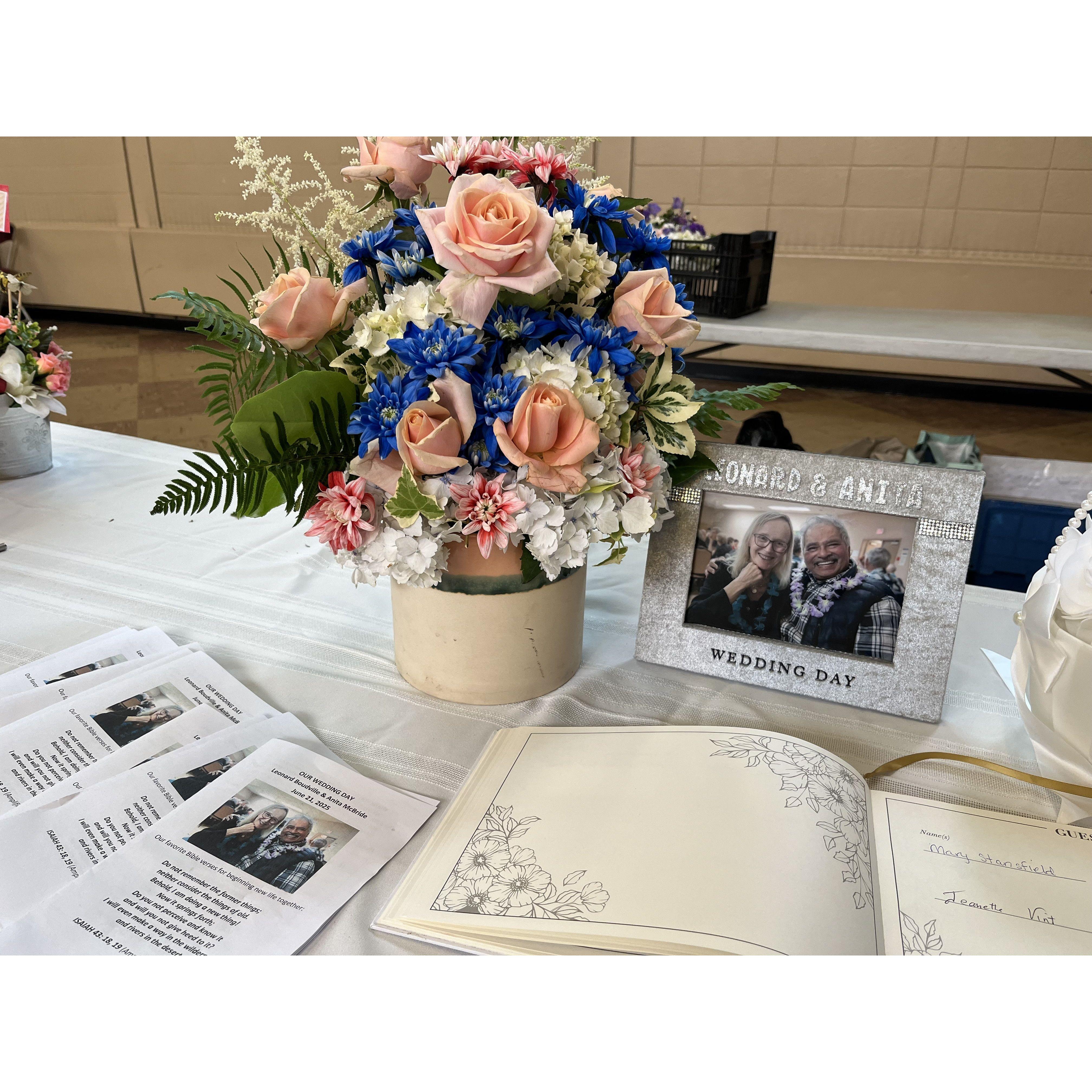 Wedding guest book, pamphlets, & bouquet