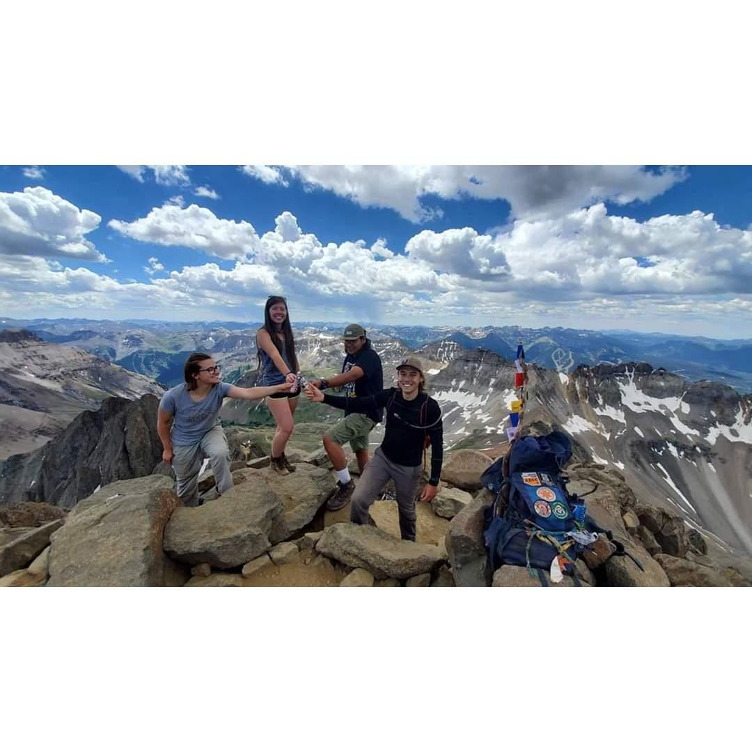 at the summit of Mt Sneffels in Colorado with friends (14,153 ft)