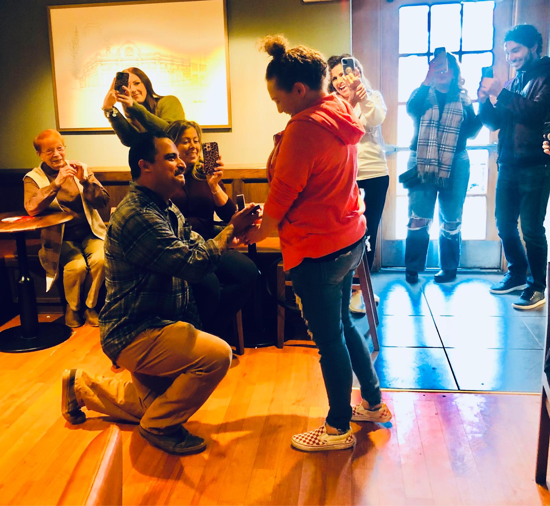 The proposal! ❤️ Starbucks on Main Street, in downtown Northville. A perfect moment surrounded by family in the most perfect spot 🥰