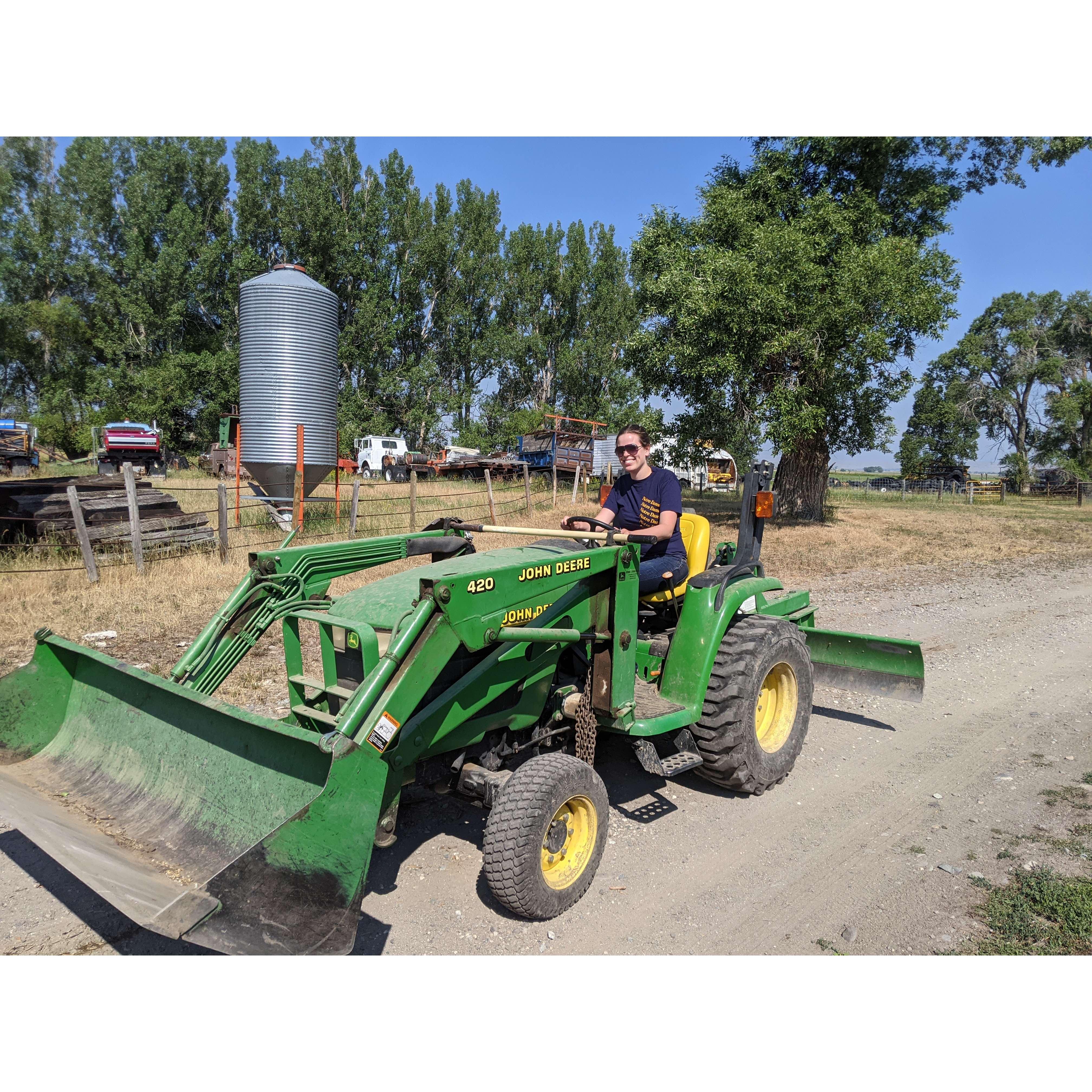 Christine is now an expert tractor driver.
