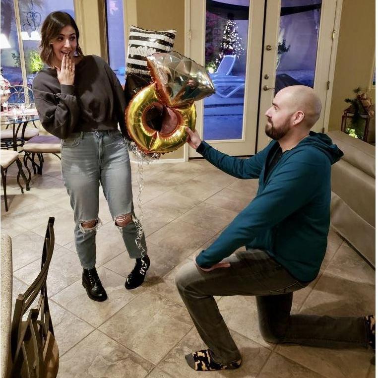Our best recreation of Nick popping the big question, during an impromptu engagement party in January 2024.