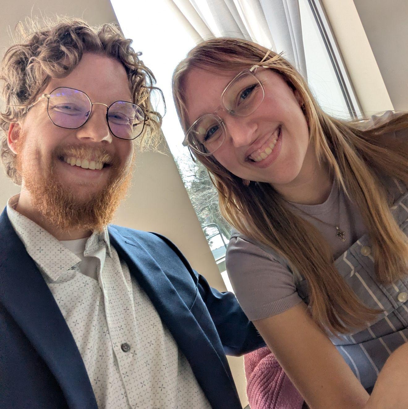 A picture taken together at a close friend's wedding. We were taking notes for ours!