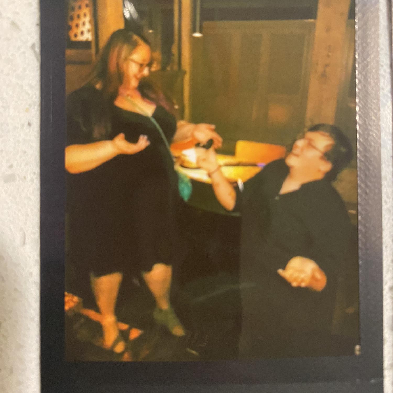 Our engagement at the Melting Pot. The table next to us took polaroid photos of this special moment for us.