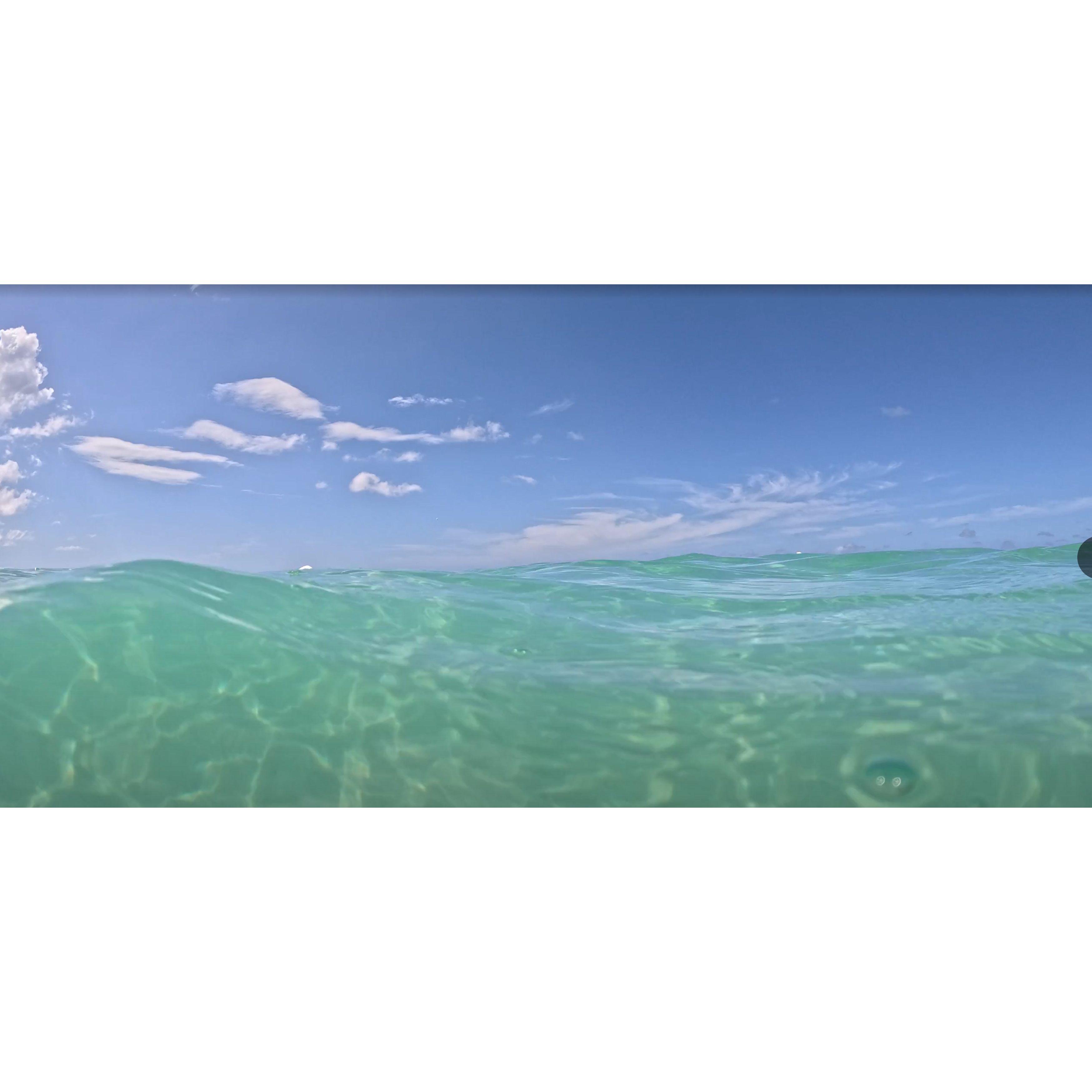 Floating on sunshine where turquoise waves meet endless skies