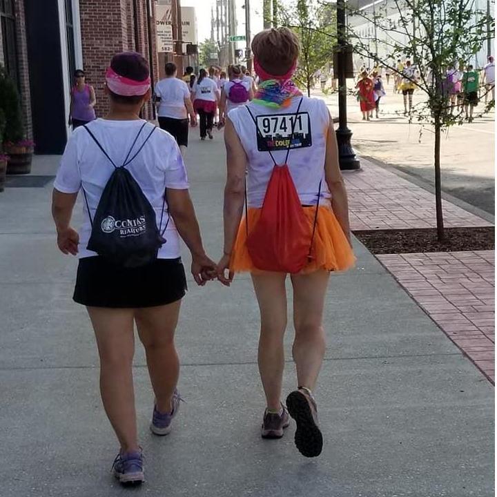 holding hands while walking the Color Run