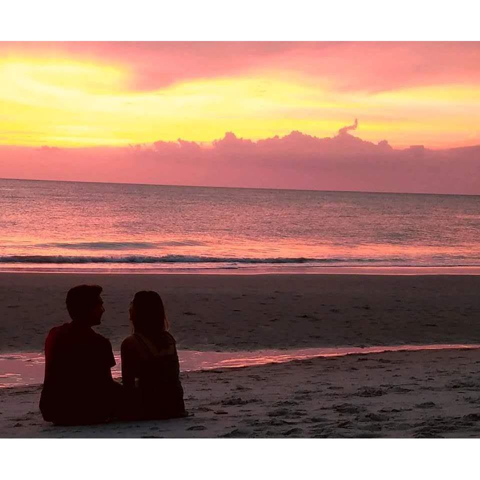 The first time Mia visited Aaron in May 2017. He took us to the beach and a stranger snapped a photo of us watching the sunset. (Sounds weirder than it was).