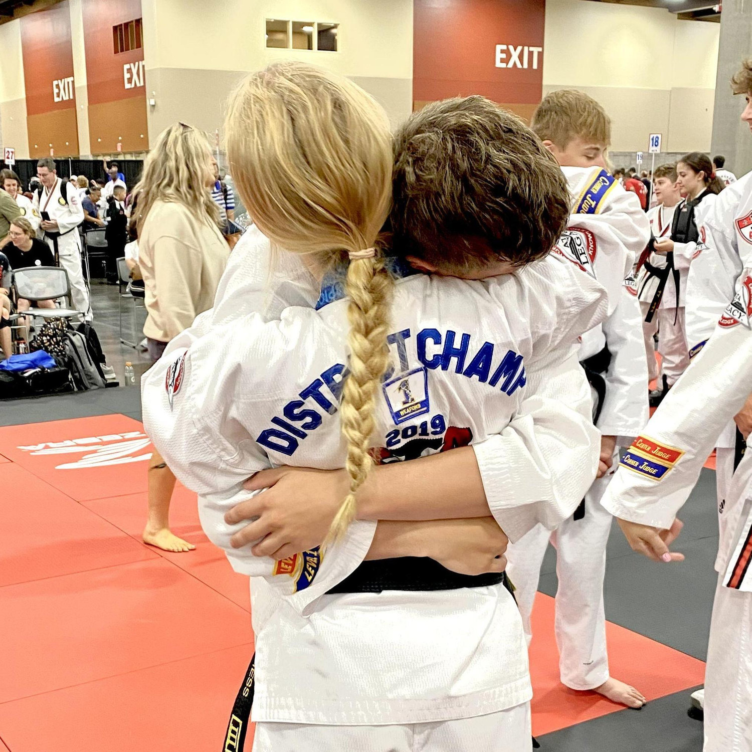 Big hug after Maddie won the World title in Combat Sparring, 2022