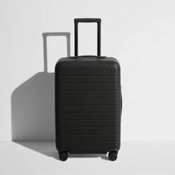 Shop The Bigger Carry-On suitcase in Jet Black