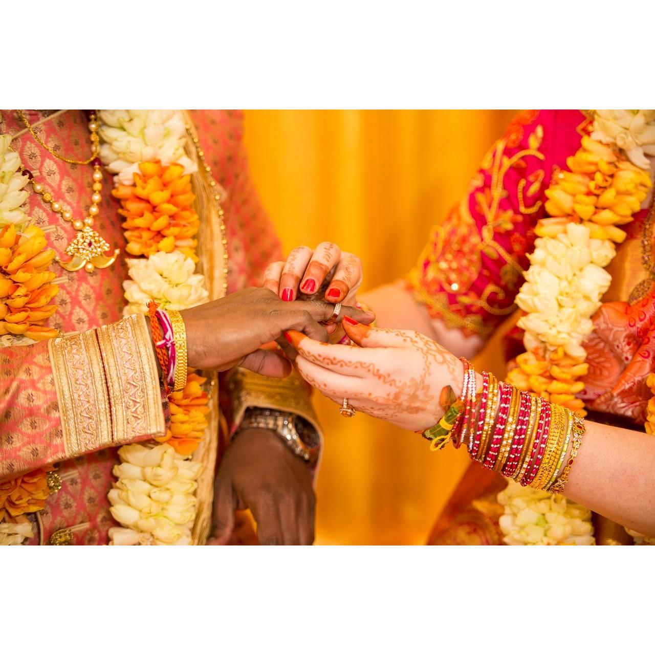 Exchanging the rings at our Hindu engagement ceremony