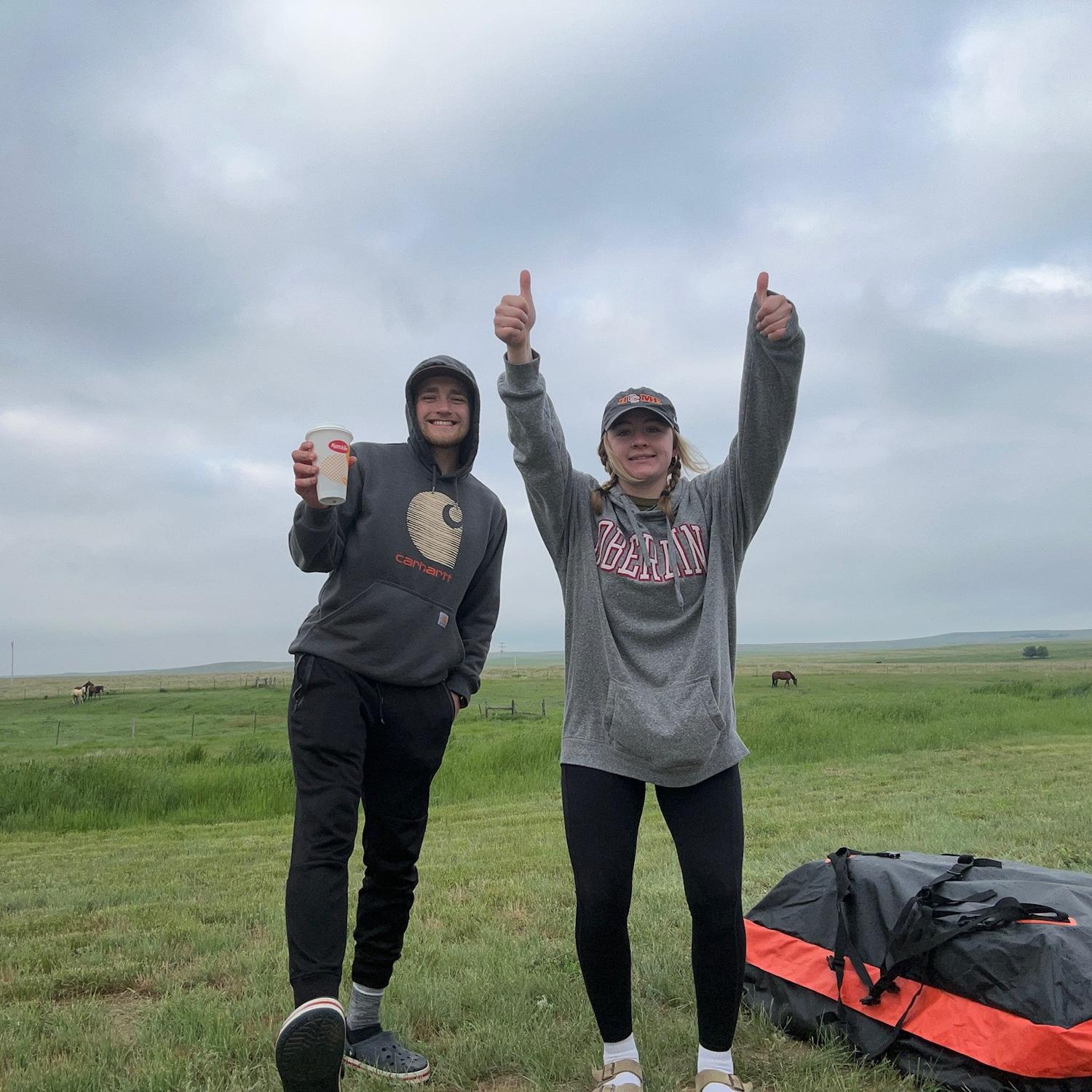 Camping in someone's backyard, somewhere in Wyoming, June 2023. You can tell by the gas station coffee and bags under our eyes that it was a rough night.
