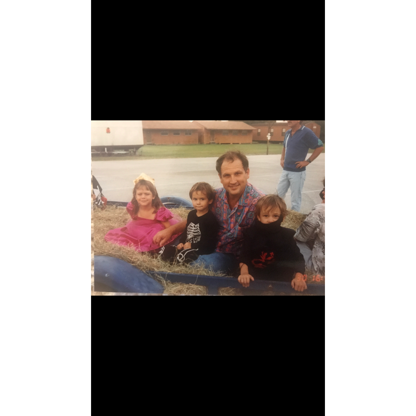 Megan, April, and Alex as children with their father