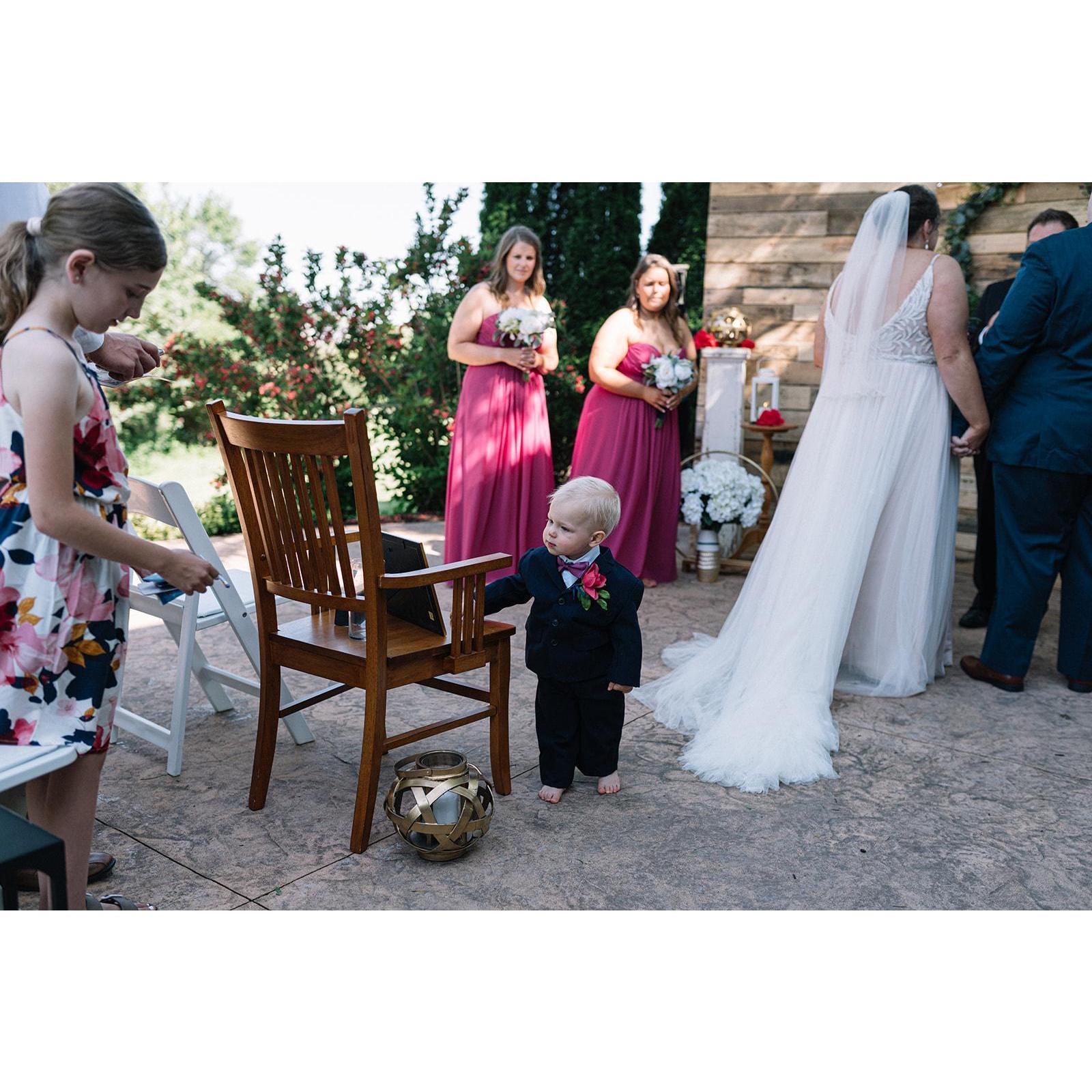 Checking out the Mother of the Bride's seat!