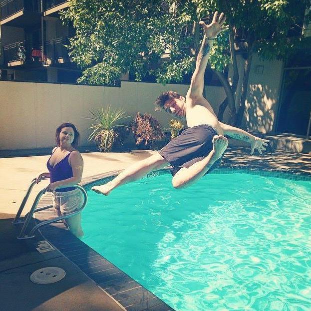 Showing off at our apartment's pool (Ashton is not impressed)