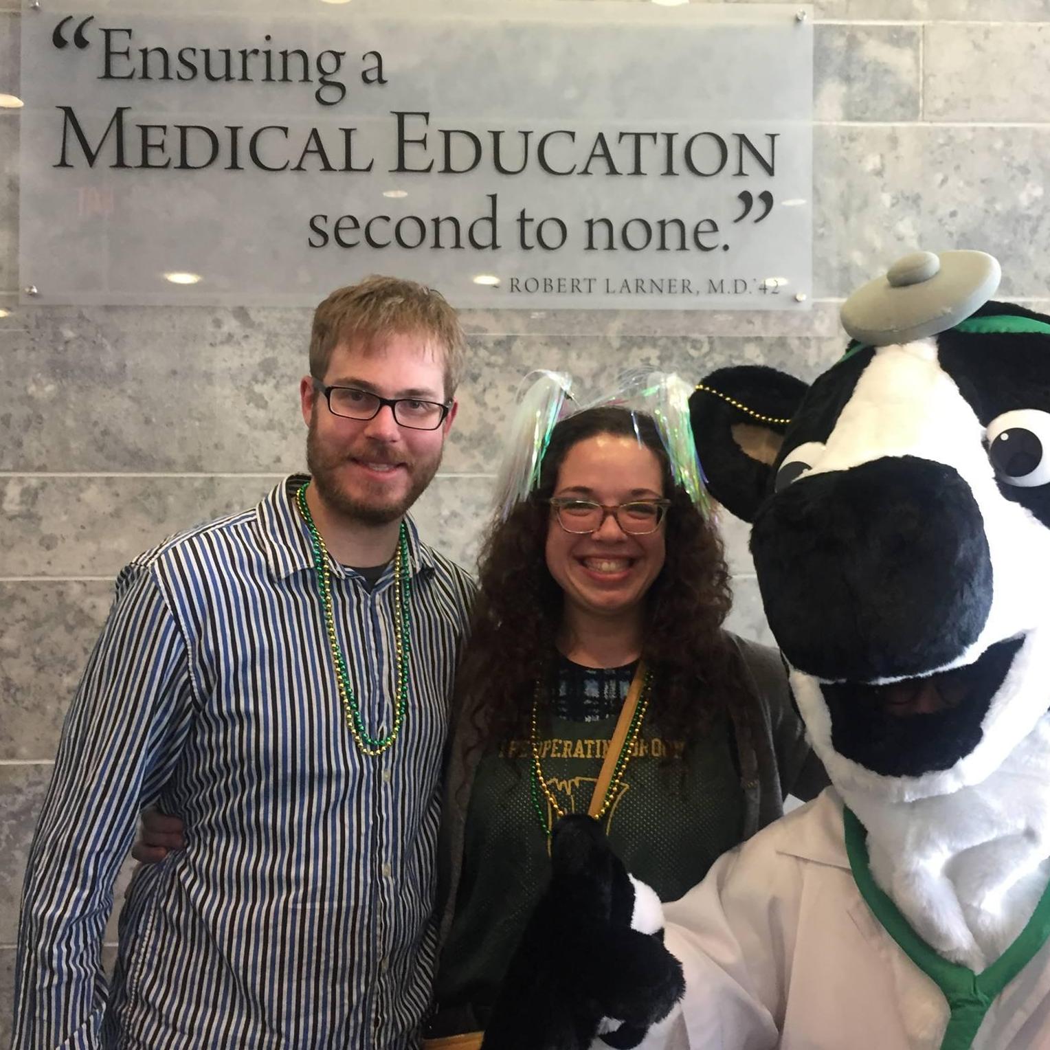 Lindsay and Benji being photobombed by Dr. Moo on Match Day 2018 at UVM College of Medicine