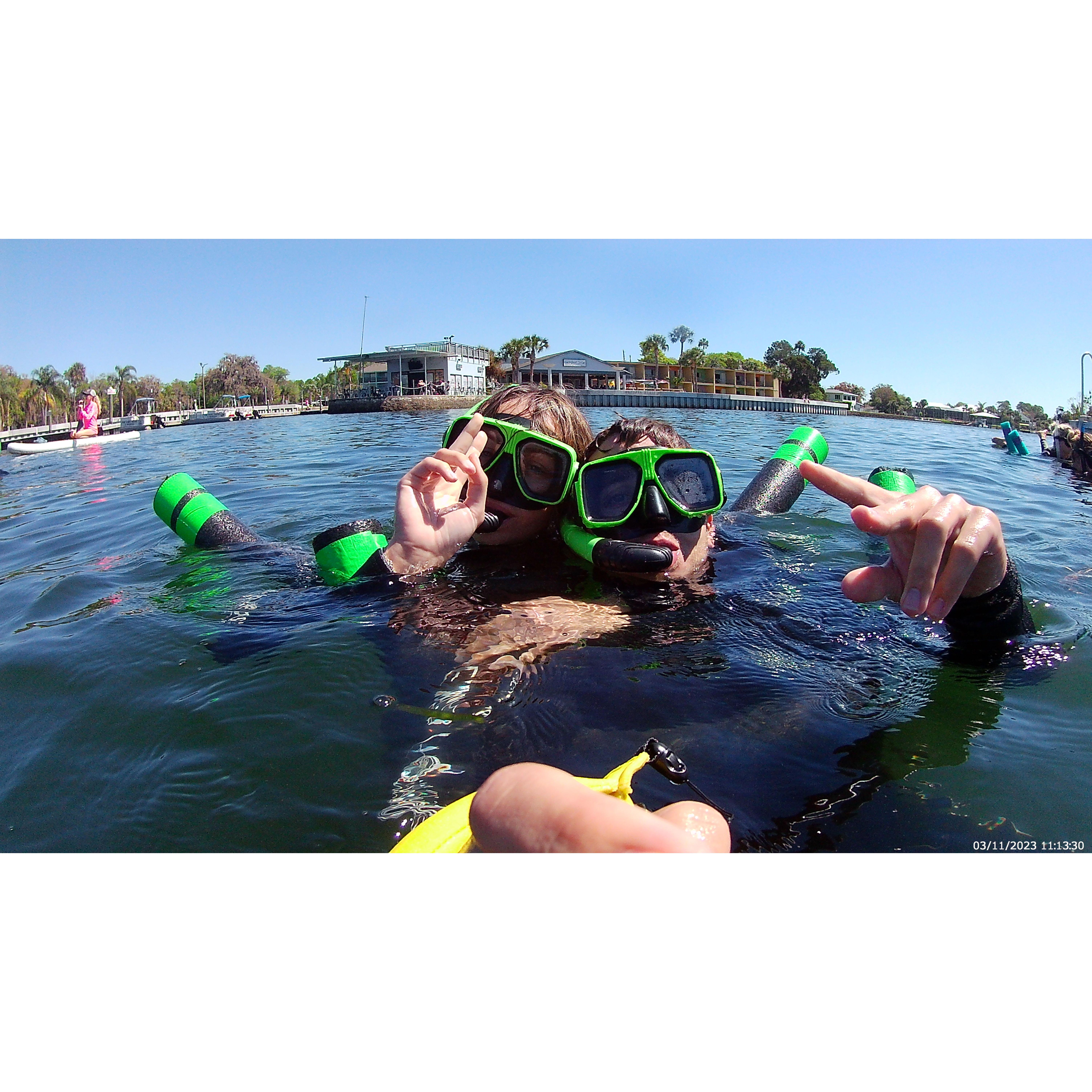 They went swimming with the manatees for their two year anniversary.