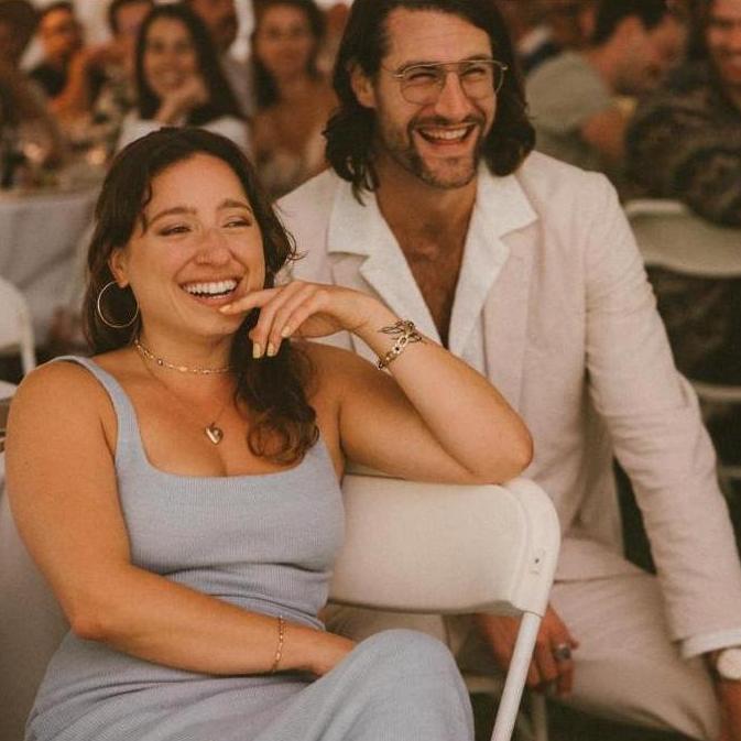 Laughing to tears at our friends' wedding, 2023.