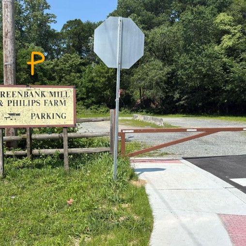 This sign is in front of the parking for the venue