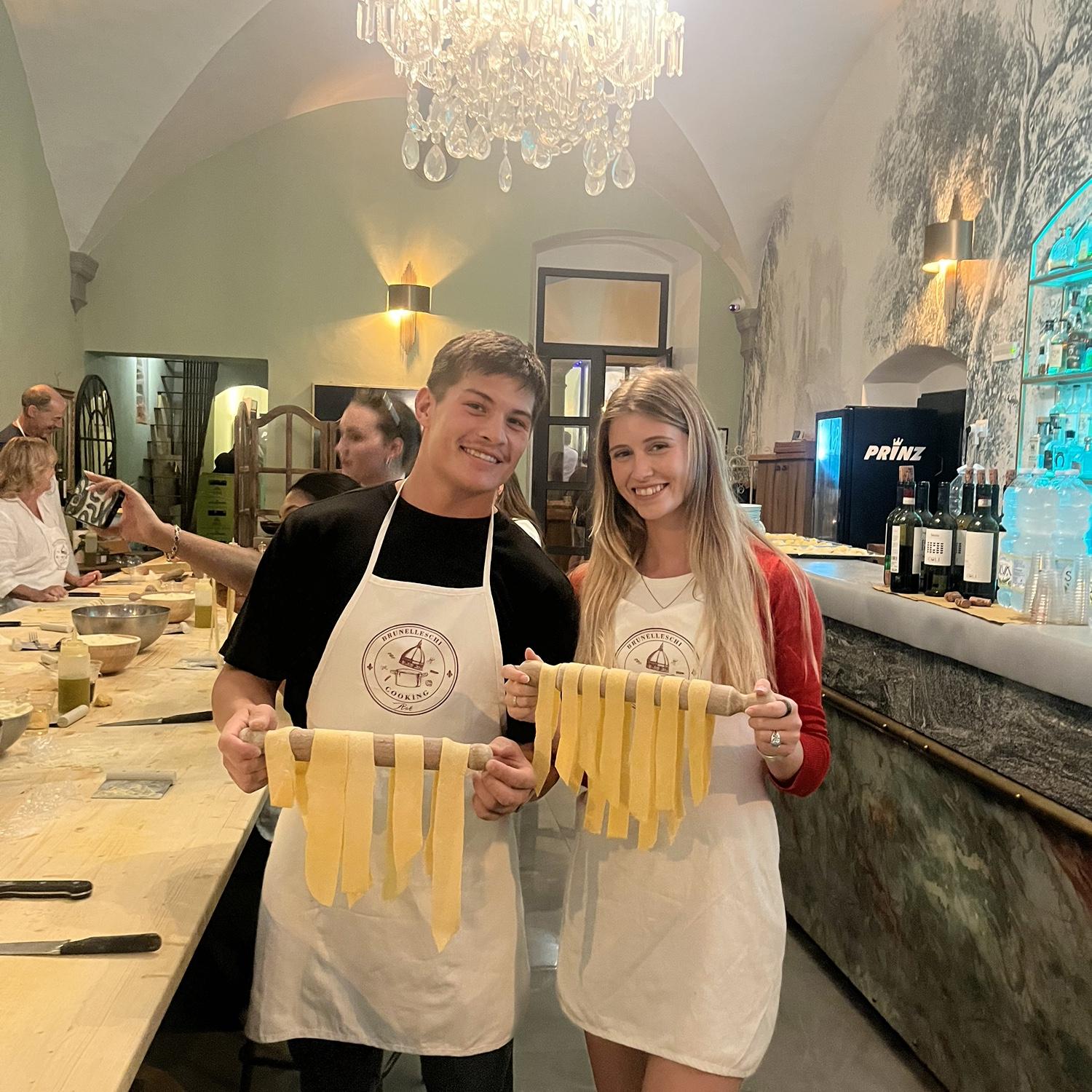 The night we got engaged we went to a pasta making class in Florence, Italy. After the class on our walk back home, Jared proposed along the Arno River.