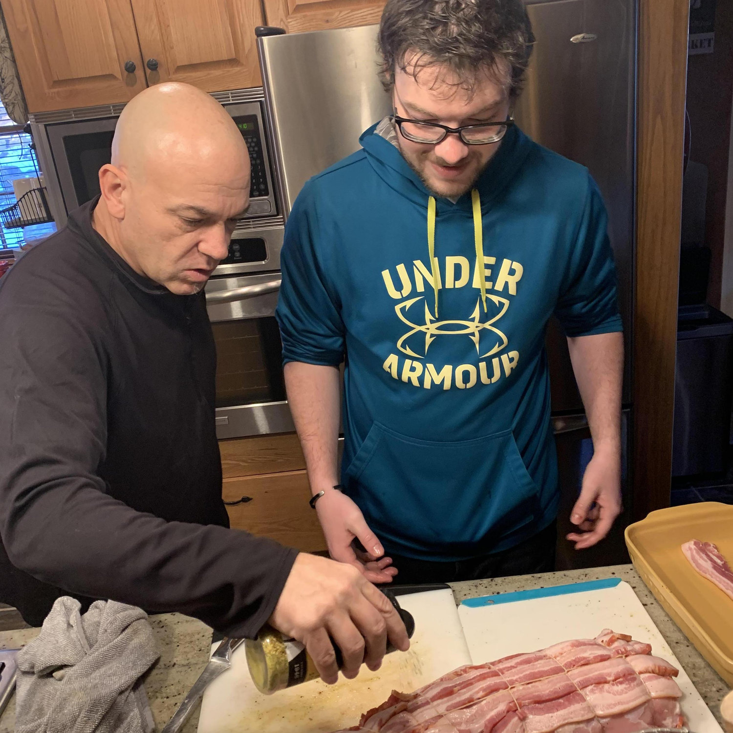 Christmas Eve 2020. H receives a cooking lesson from Dad. It didn't stick... M still does all the cooking.