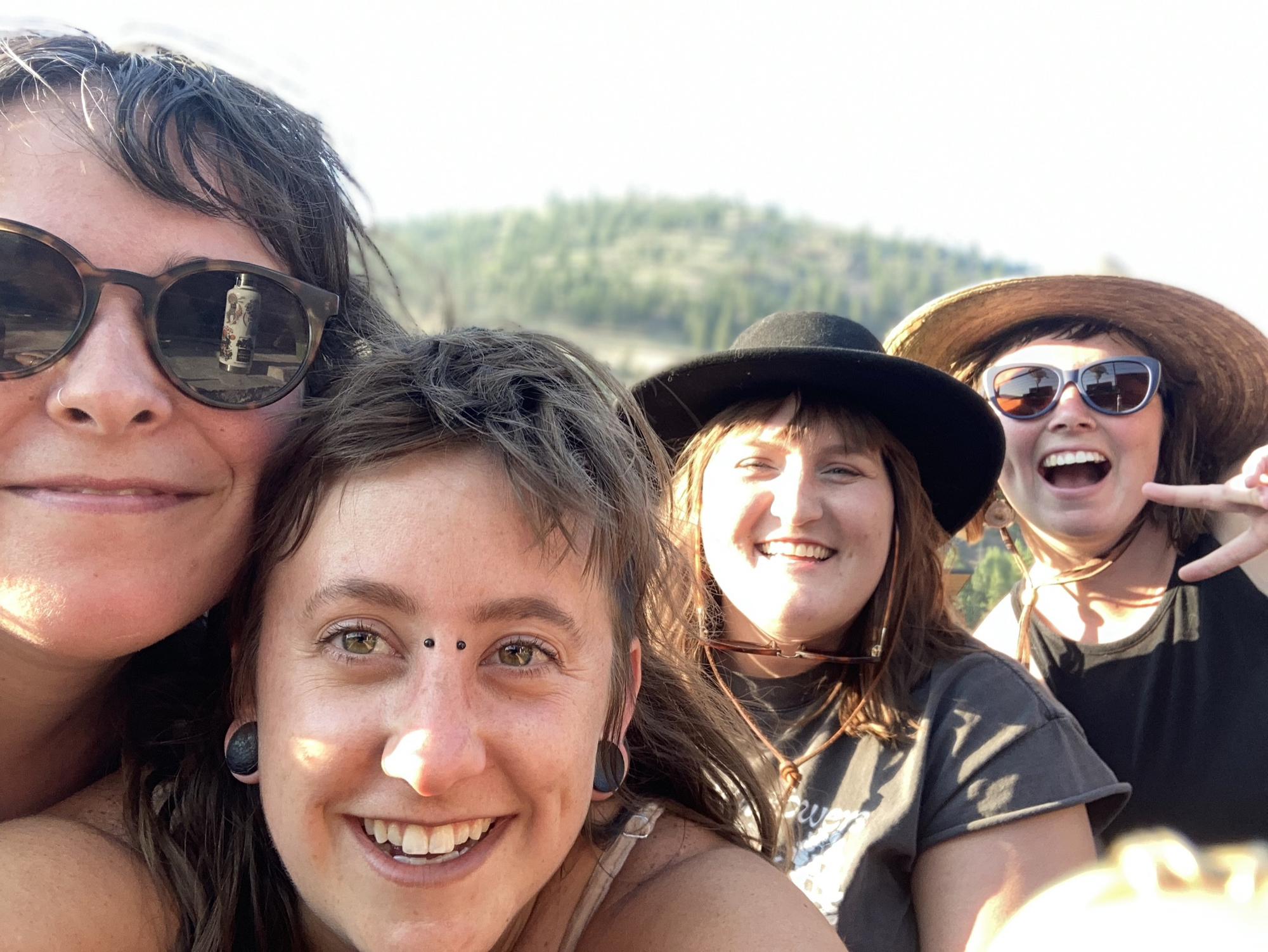 Kayte with friends Abby, Stephanie and Claire at an outdoor concert in Missoula in 2022