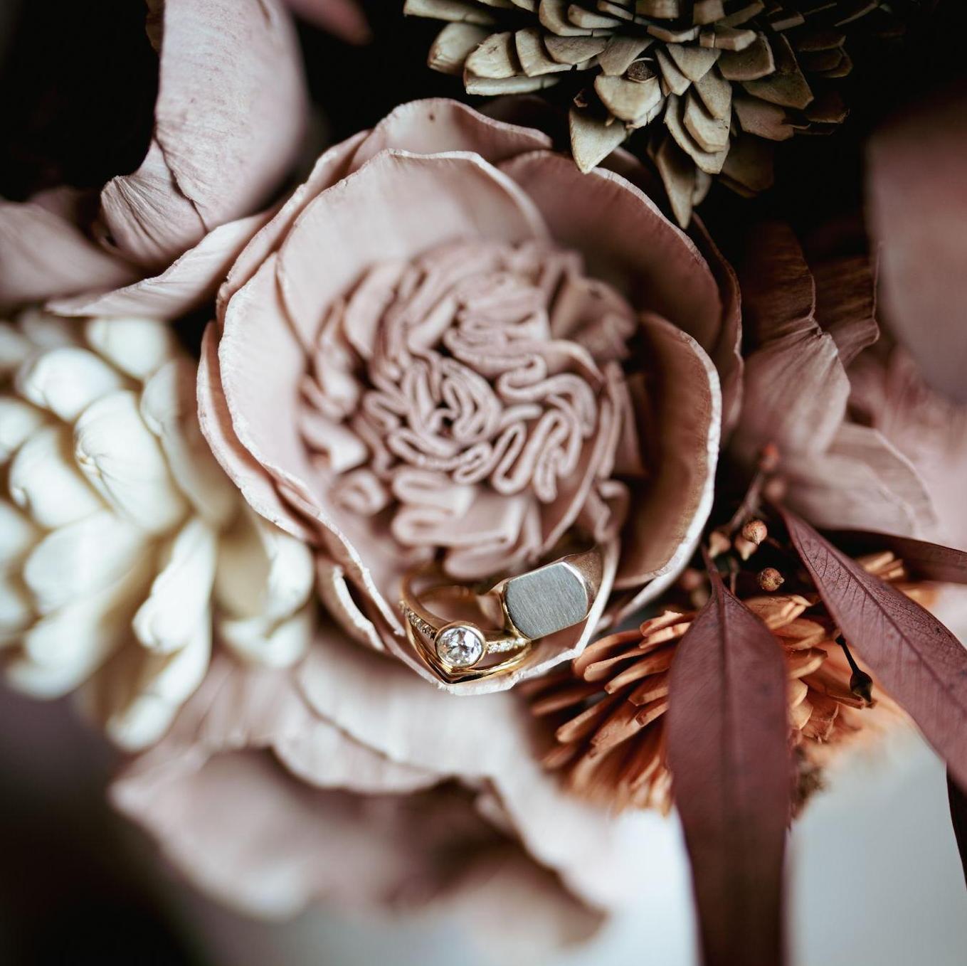 Flowers purchased from Sola Wood & arranged by us. Rings purchased from Abracadabra in Ann Arbor, MI.