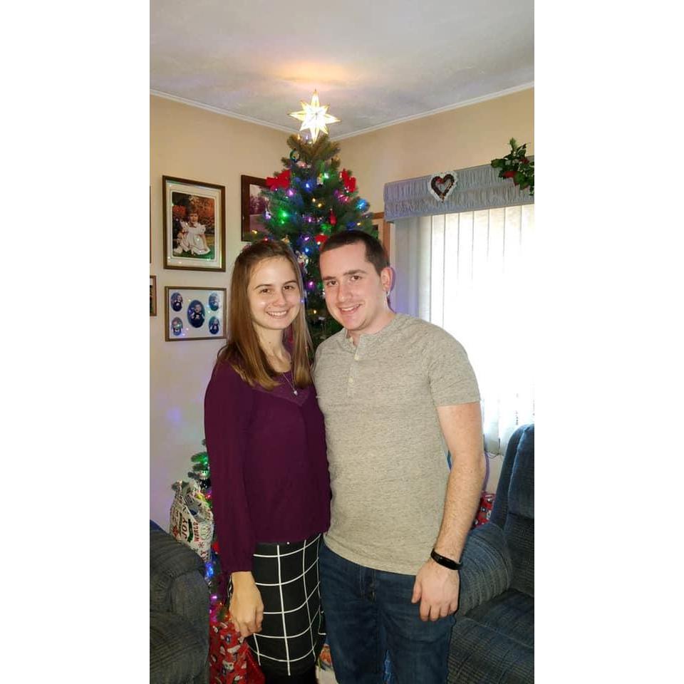 Merry Christmas at David's house in front of the tree <3