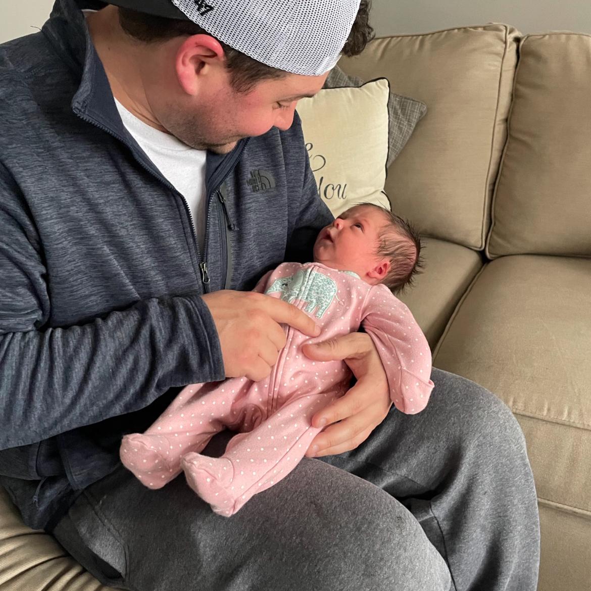 Uncle Chris meets niece Emelia in March of 2022.