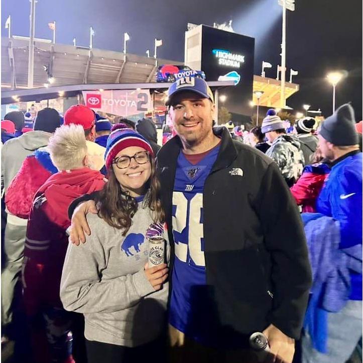 Rachel tried to convert Matt to be a Bills fan...we can see from his attire how that went