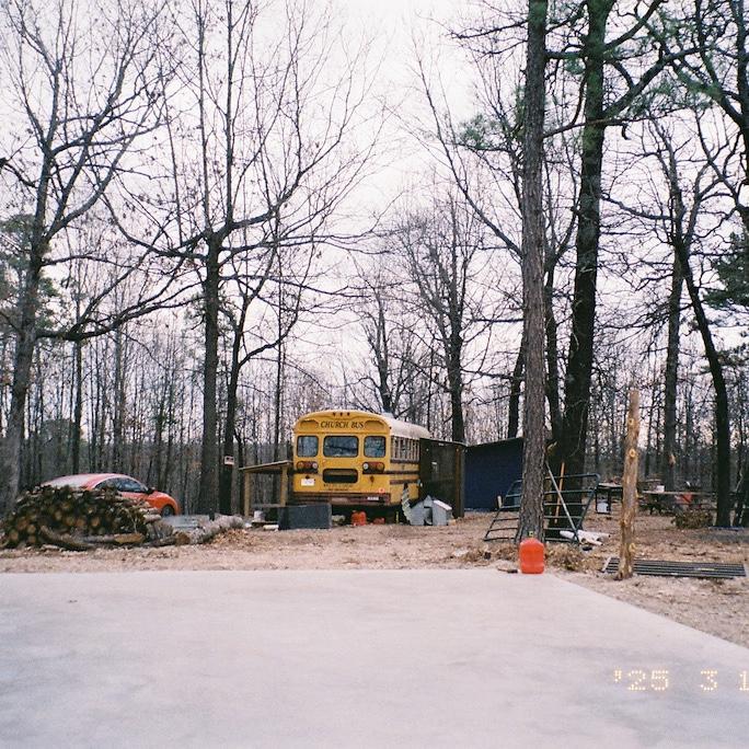 Spring 2025 the concrete for our house/barn was laid and we were living in the bus full time! We built a pen for my goats and moved them over too!