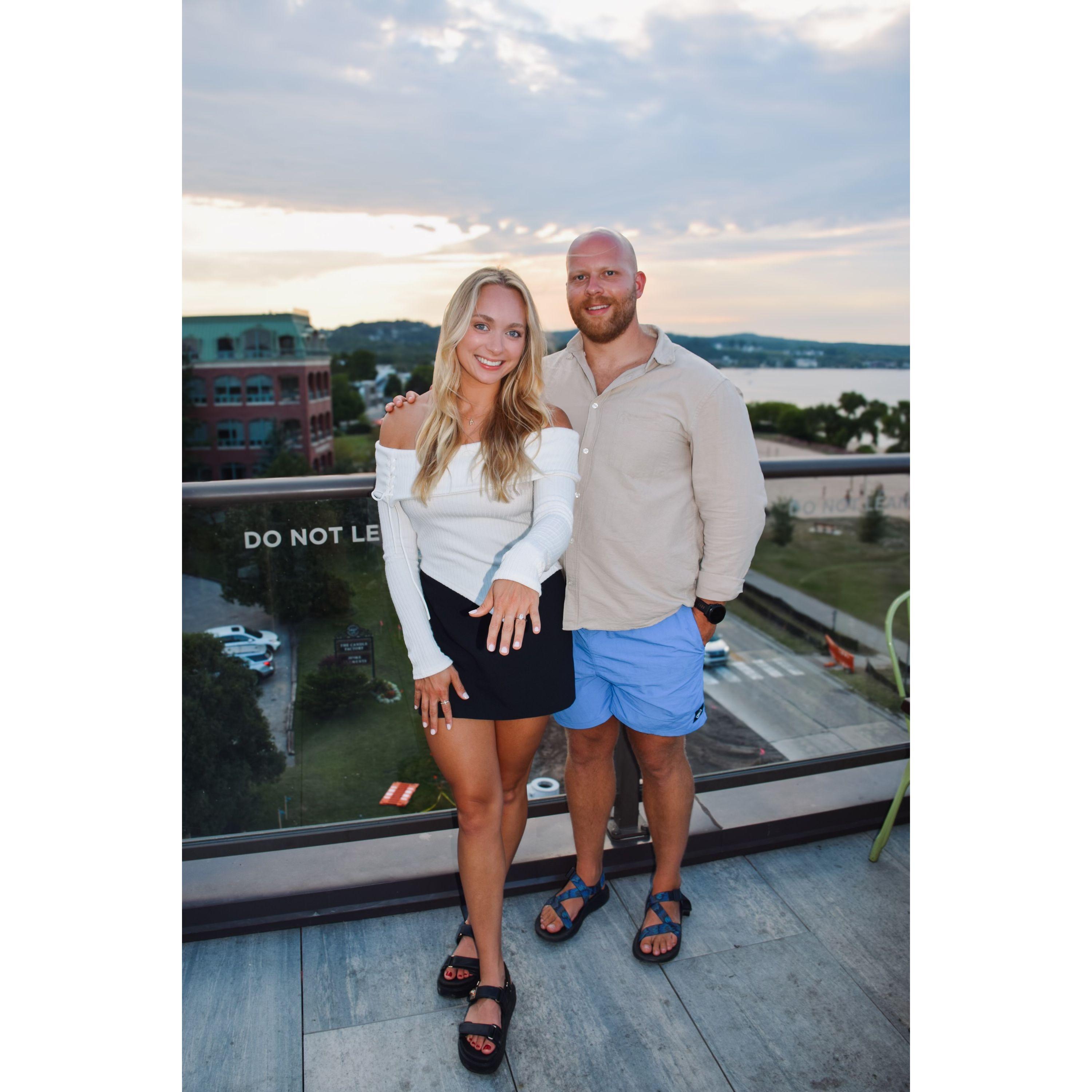 Anna and Adam celebrated their engagement with a party at the Hotel Indigo Rooftop, following Adam's proposal on Mackinac Island in July 2024.